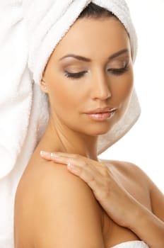 Portrait of 20-25 years old beautiful woman wearing towel on her head