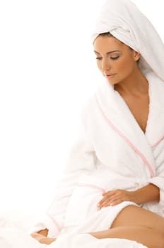 Portrait of 20-25 years old beautiful woman on white bed