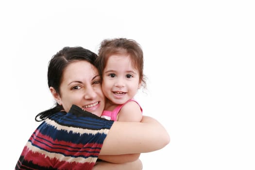beautiful young mother and her two year old daughter looking at camera