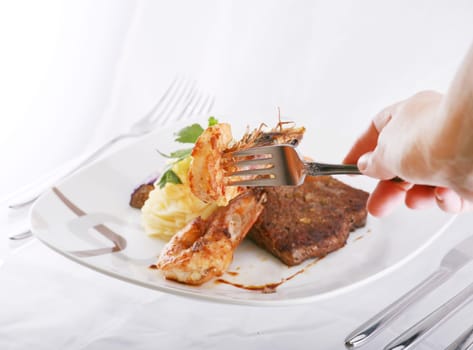 shrimp on fork over a mix food background