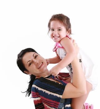 little girl hugging to mother, in her arms