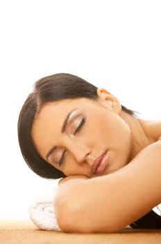 Portrait of Fresh and Beautiful brunette woman taking stone therapy