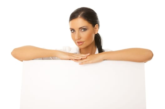 Beautiful business woman holding empty white board