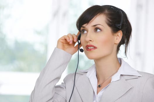 Beautiful business woman is working in her office