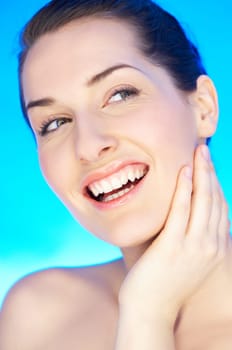 Portrait of 20-25 years old beautiful woman on blue background