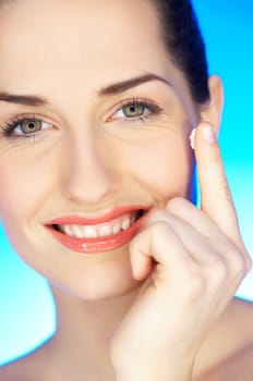 Portrait of 20-25 years old beautiful woman with cream