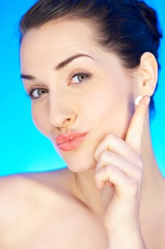 Portrait of 20-25 years old beautiful woman with cream