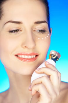 Portrait of 20-25 years old beautiful woman with cream