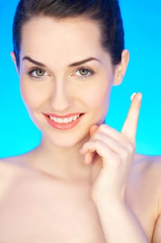 Portrait of 20-25 years old beautiful woman with cream