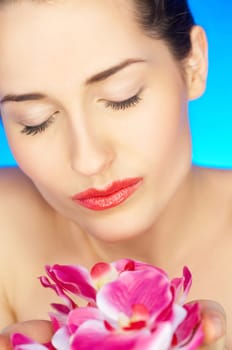 Portrait of beautiful woman holding bunch of flowers