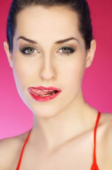 Portrait of beautiful woman on pink background