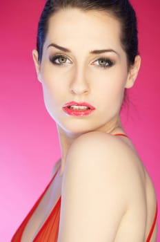 Portrait of beautiful woman on pink background