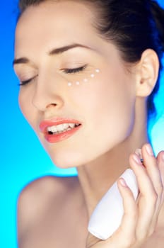 Portrait of 20-25 years old beautiful woman with cream