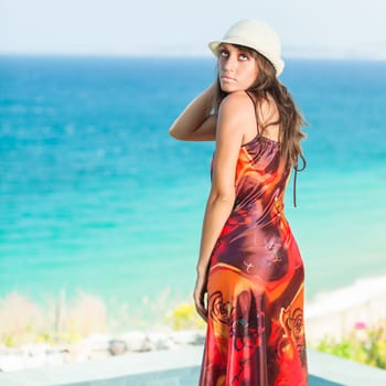 Woman in hat near the sea