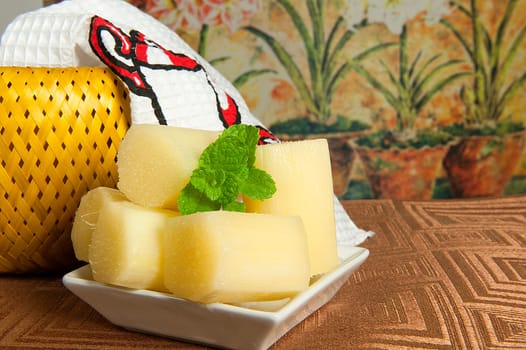 dish with pieces of natural sugar cane