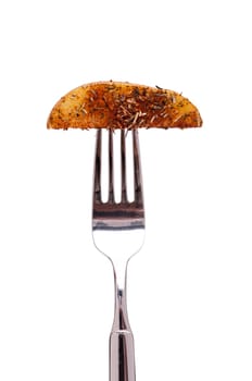 White Isolated Fried Potato with Herbs on a Fork