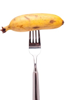 White Isolated Banana with Banana Peel on a Fork