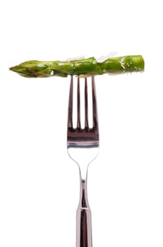 White Isolated Roasted Green Asparagus with Parmesan on a Fork