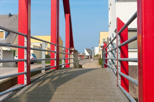 modern red footbridge in Beuningen, Netherlands