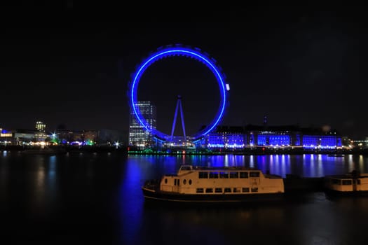 London eye at night  from northbank with ship in foreground