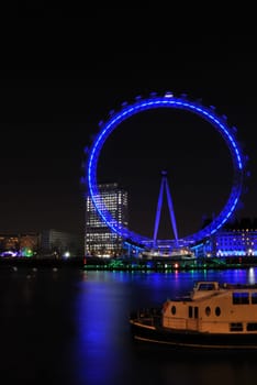 London eye by night in portrait view