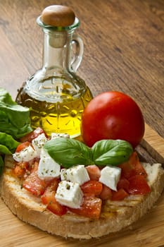 italian bruschetta with fresh tomatoes, basil, garlic, olive oil and cheese