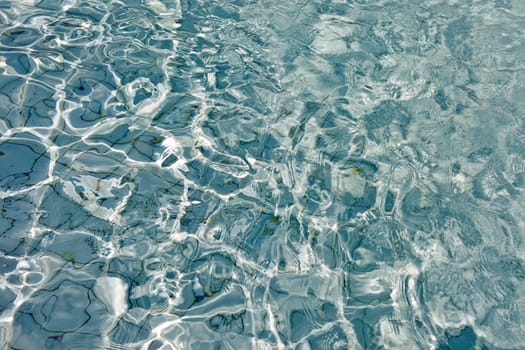 The Most beautiful clear pool water reflecting in the sun