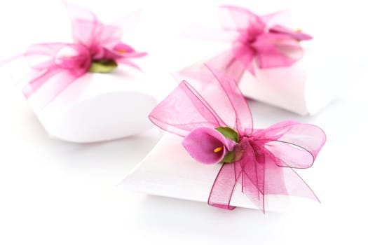 Small gift box decorated with ribbon and flower