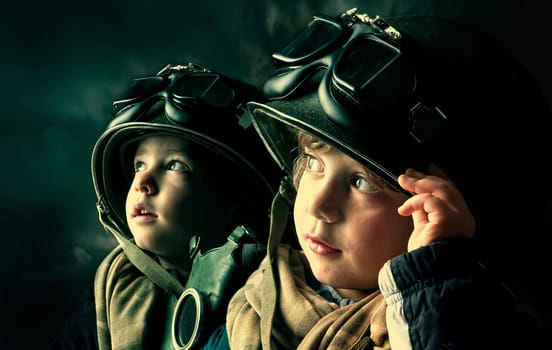 Two young boy soldiers looking at the skies
