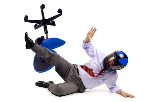 Businessman racer crashing in a chair with helmet