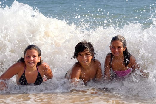 Siblings having fun on the beach