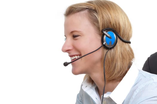 Smiling young woman using headset on phone