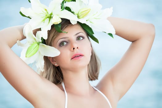 Close-up portrait of a young beautiful woman in wreath