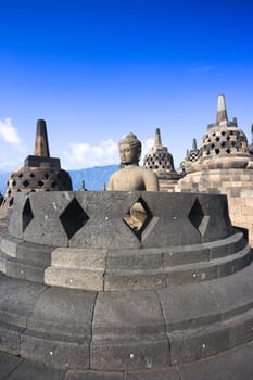 Buddha statue in stupa. Borobudur. Java. Indonesia
