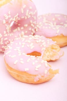 Closeup of Homemade Donuts with Pink Icing - Shallow Depth of Field