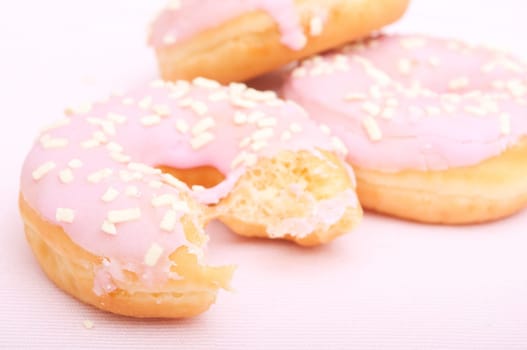 Closeup of Homemade Donuts with Pink Icing - Shallow Depth of Field