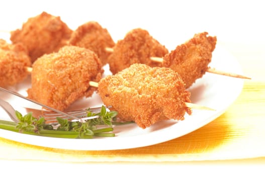 deep-fried chicken breast on a skewer