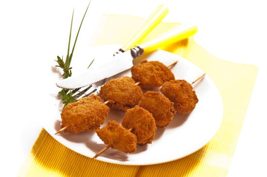 deep-fried chicken breast on a skewer