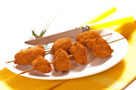 deep-fried chicken breast on a skewer