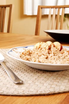 A bowl of porridge with apple and cinnamon spices
