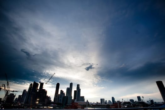Singpore skyline in dramatic clouds - silhouette