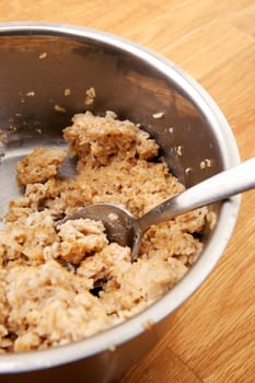 A pot of old cold porridge on a wooden table