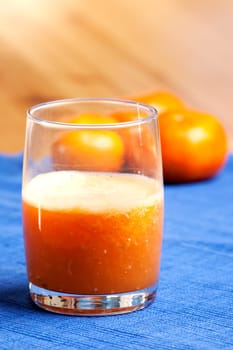 A fresh orange smoothie made with fresh fruit
