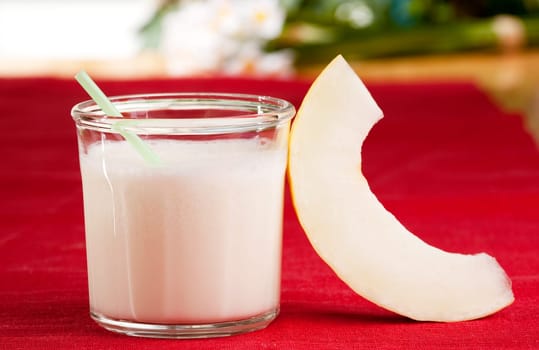 A sweet melon smoothie in an outdoor setting