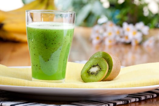 A tasty kiwi smoothie in a natural setting