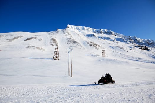 A winter landscape with a snowmobile
