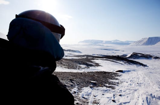 A winter adventure guide on a barren winter landscape