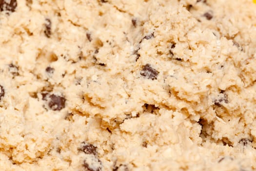 A cookie dough detail with wood spoon