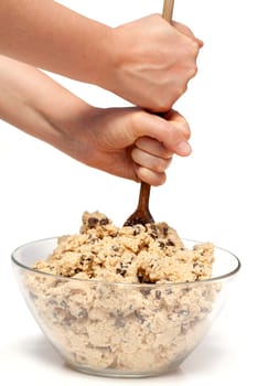 mixing a large bowl of chocolate chip cookie dough