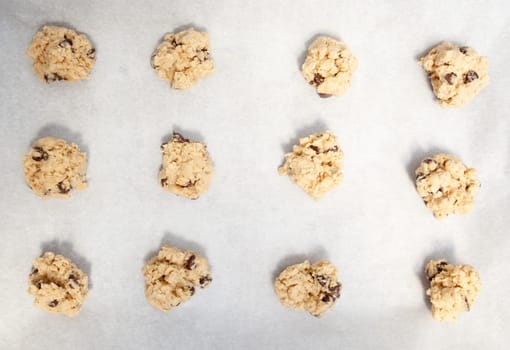Cookie dough on a cookie sheet with baking paper